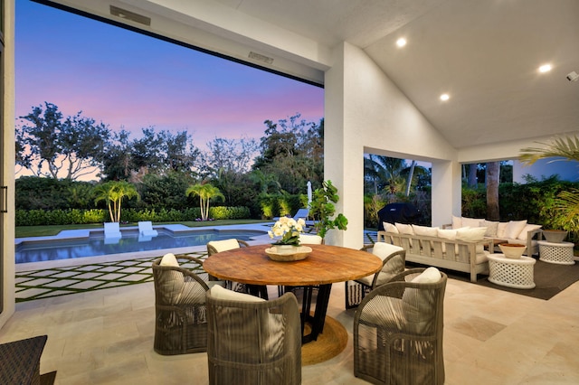 patio terrace at dusk with an outdoor living space