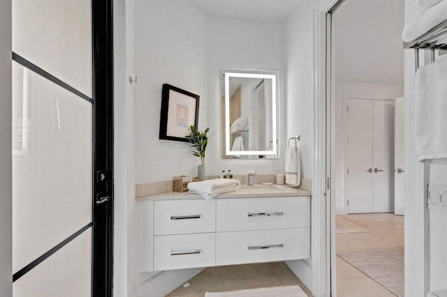 bathroom with tile patterned flooring and vanity