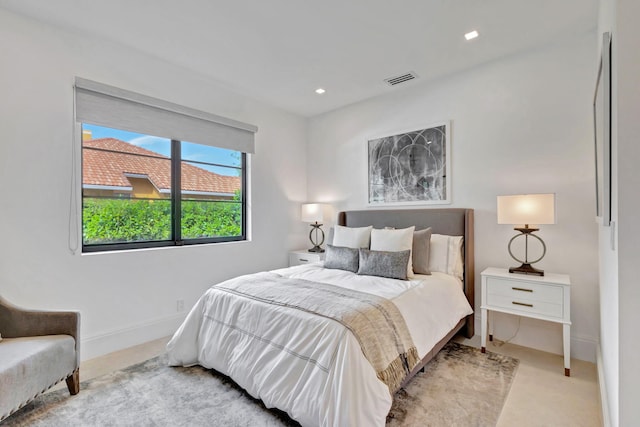 bedroom featuring light carpet