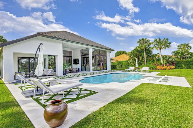 view of pool featuring a patio area and a yard