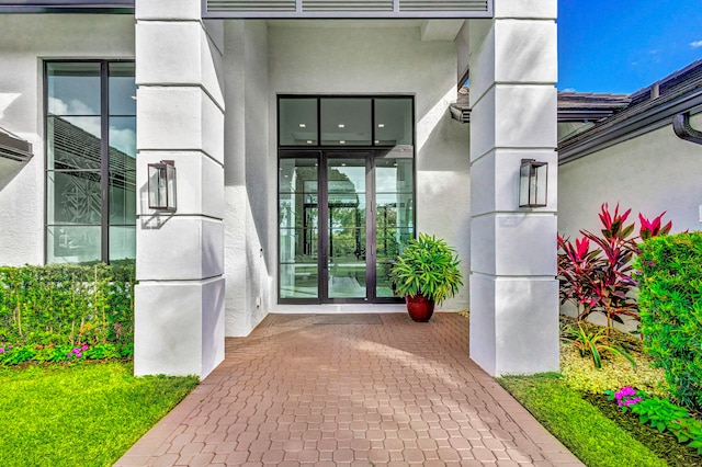 view of exterior entry featuring french doors