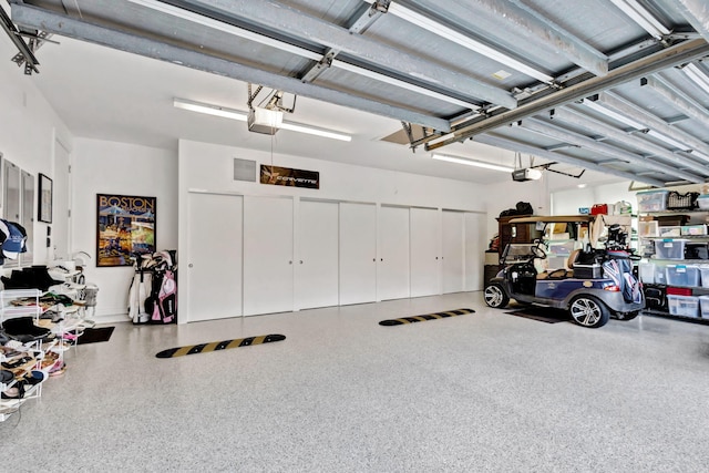 garage featuring a garage door opener