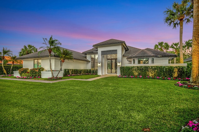 view of front of property with a yard