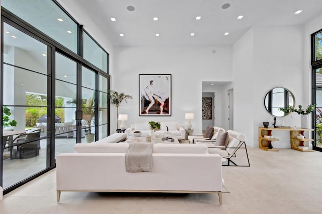 living room with a high ceiling