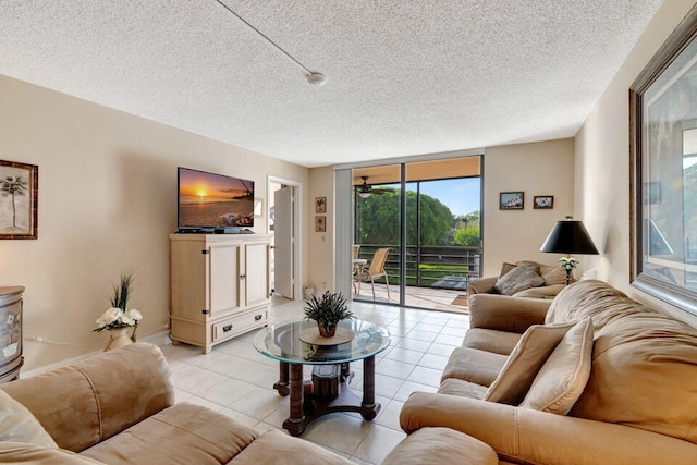 living room featuring a textured ceiling, rail lighting, and light tile patterned floors