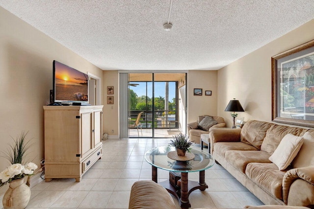 living room featuring a textured ceiling and light tile patterned flooring