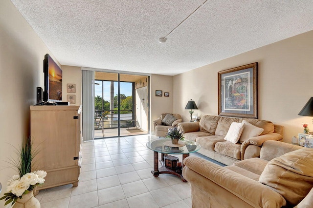 tiled living room with a wall of windows and a textured ceiling