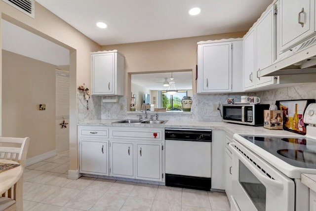 kitchen with ventilation hood, sink, white cabinetry, and white appliances