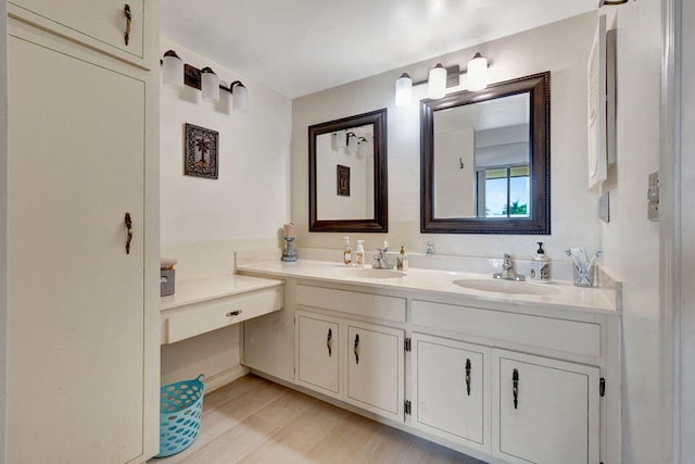 bathroom with vanity and wood-type flooring