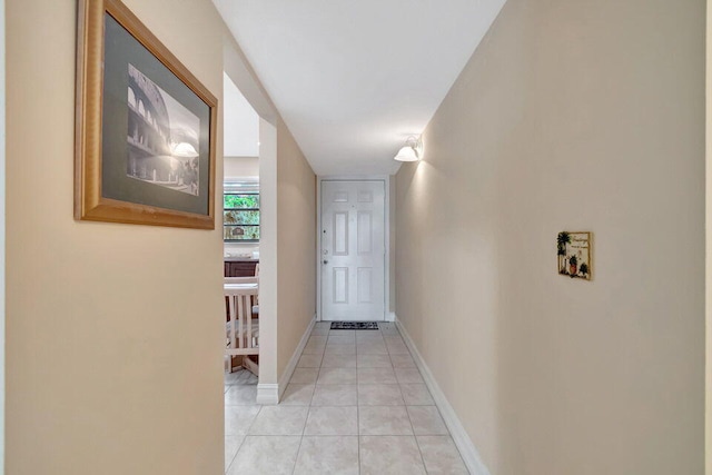 corridor with light tile patterned floors