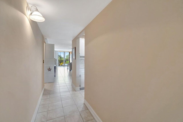 hallway featuring light tile patterned floors