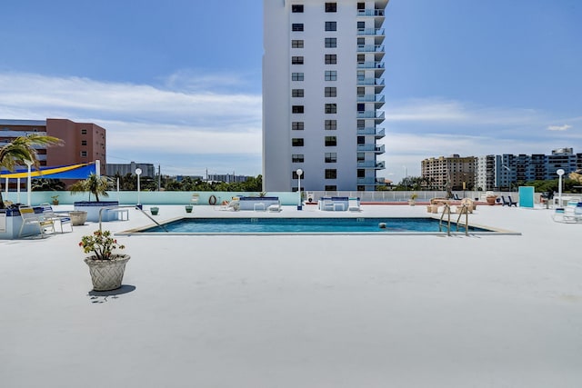 view of swimming pool featuring a patio