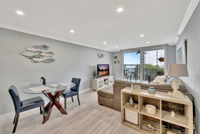 living room with crown molding and light wood-type flooring