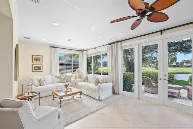 4 Country Rd, Village Of Golf, FL 33436 - tiled living room with french doors, a water view, ceiling fan, and ornamental molding