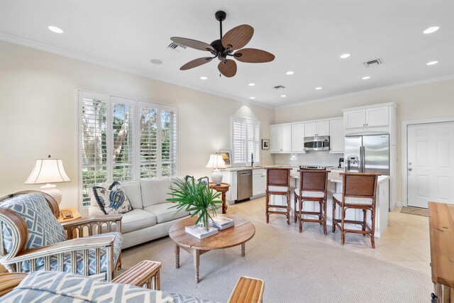 4 Country Rd, Village Of Golf, FL 33436 - tiled living room with crown molding and ceiling fan