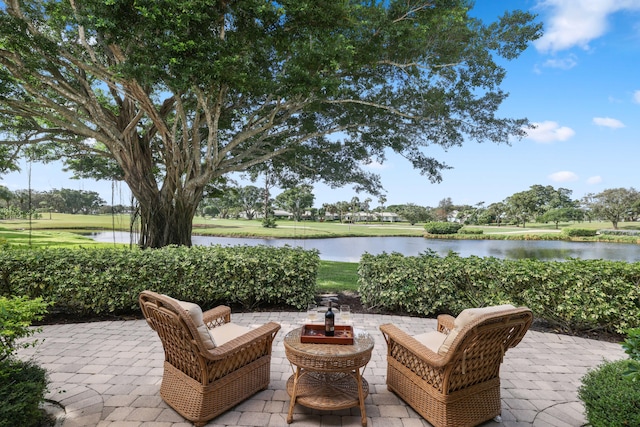 view of patio with a water view