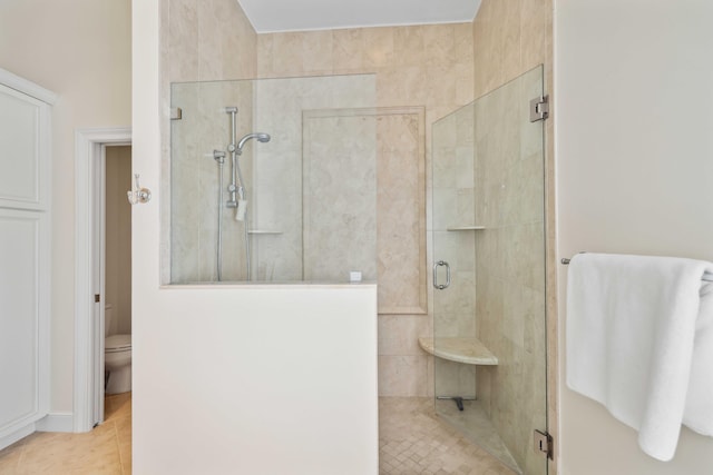 4 Country Rd, Village Of Golf, FL 33436 - bathroom with tile patterned floors, toilet, and an enclosed shower