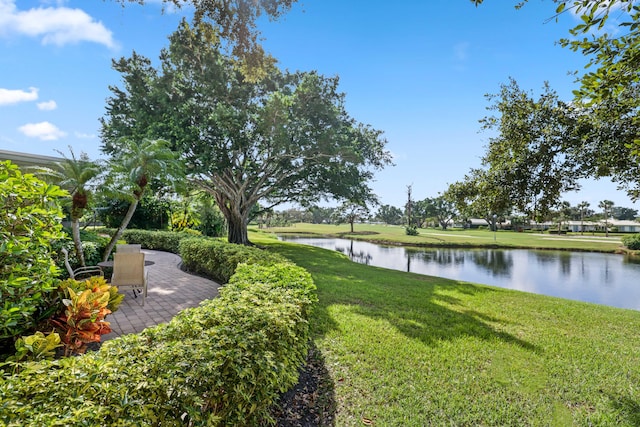4 Country Rd, Village Of Golf, FL 33436 - view of yard featuring a water view and a patio