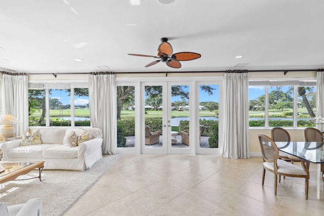 4 Country Rd, Village Of Golf, FL 33436 - tiled living room featuring ceiling fan, a water view, and french doors