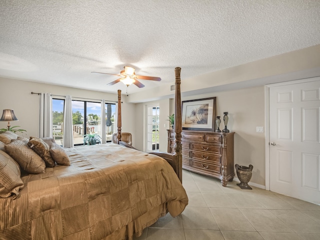 bedroom with light tile patterned floors, a textured ceiling, access to outside, and ceiling fan