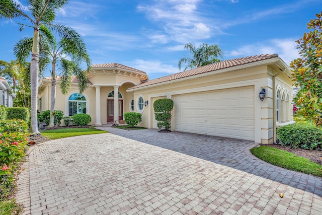 mediterranean / spanish-style house featuring a garage