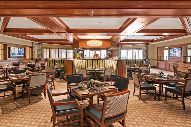 dining room featuring coffered ceiling, light colored carpet, and beam ceiling