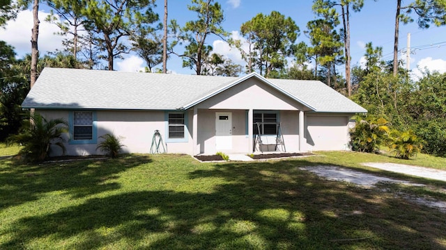 ranch-style home featuring a front yard