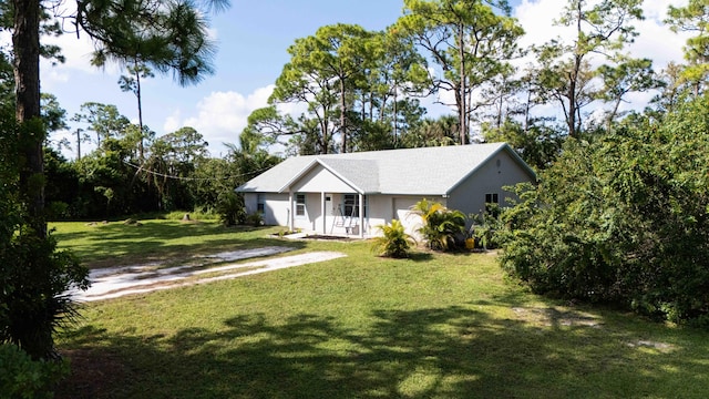 view of front of property with covered porch and a front yard