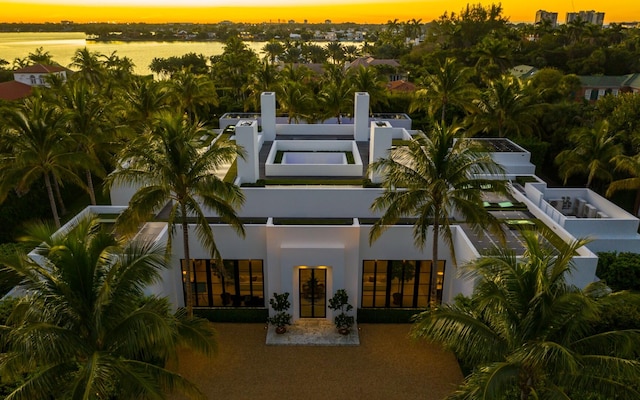 view of outdoor building at dusk