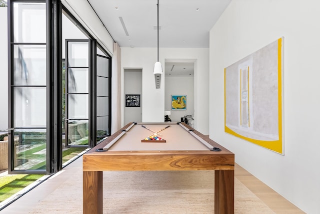 game room featuring light hardwood / wood-style flooring and billiards