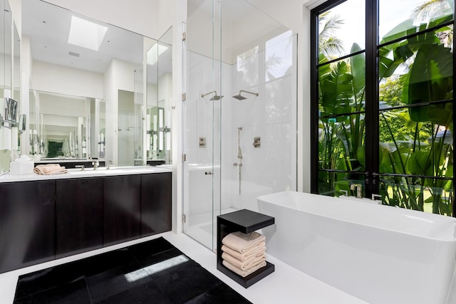 bathroom with vanity, shower with separate bathtub, and tile patterned floors