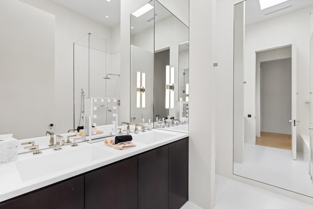 bathroom featuring vanity, a shower, and tile patterned flooring