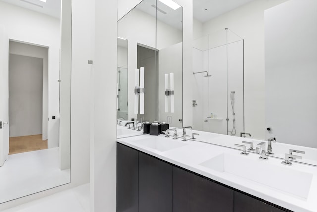 bathroom with vanity and an enclosed shower