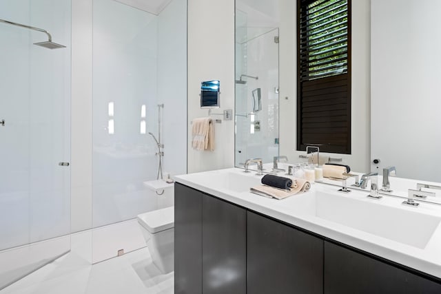 bathroom with vanity, a shower with shower door, toilet, and tile patterned floors