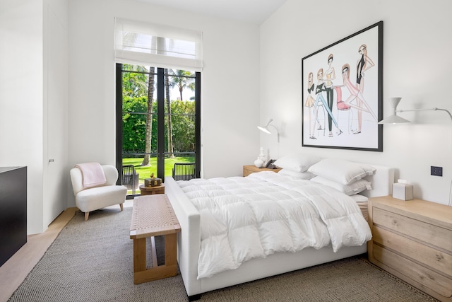 bedroom featuring light carpet