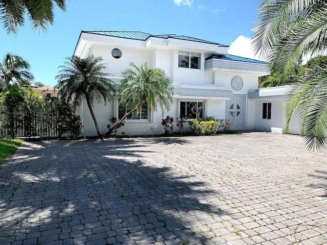 1740 SE 7th St, Fort Lauderdale, FL 33316 - art deco inspired home featuring a standing seam roof, metal roof, and stucco siding