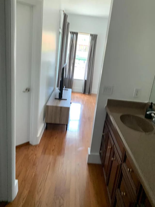 bathroom featuring vanity and wood-type flooring