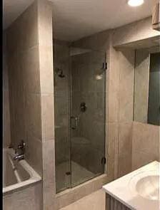 1740 SE 7th St, Fort Lauderdale, FL 33316 - bathroom with a washtub, a shower stall, and vanity