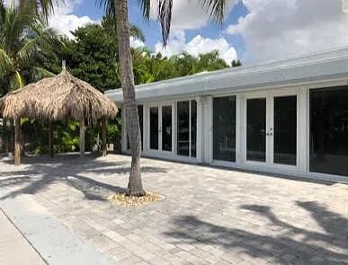 rear view of house featuring french doors and a patio area