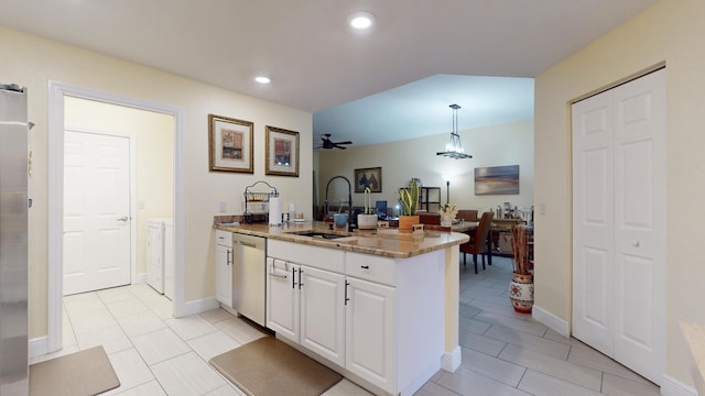 kitchen featuring pendant lighting, white cabinets, sink, stainless steel dishwasher, and ceiling fan