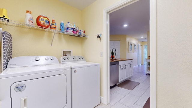 laundry area with washer and dryer and sink