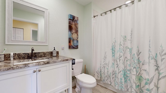 bathroom featuring toilet, vanity, tile patterned floors, and curtained shower