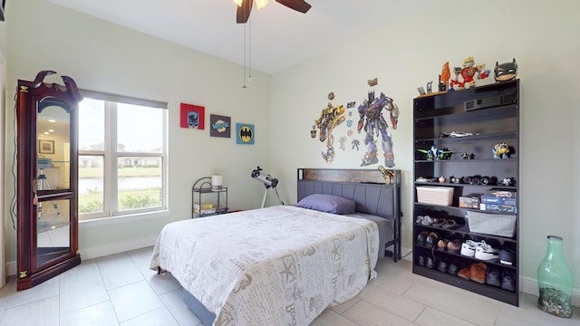 bedroom featuring ceiling fan and light tile patterned floors