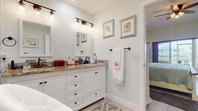 bathroom featuring ceiling fan and vanity