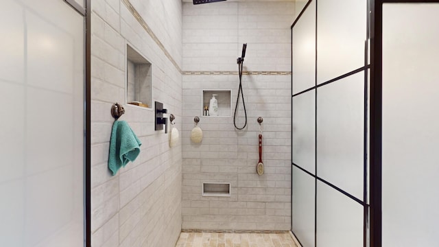 bathroom with a tile shower