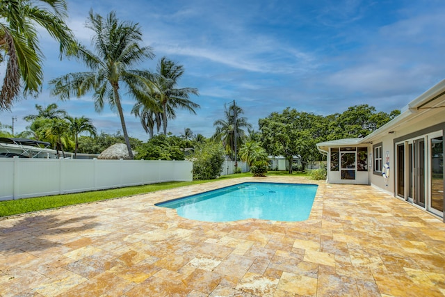 view of swimming pool featuring a patio area