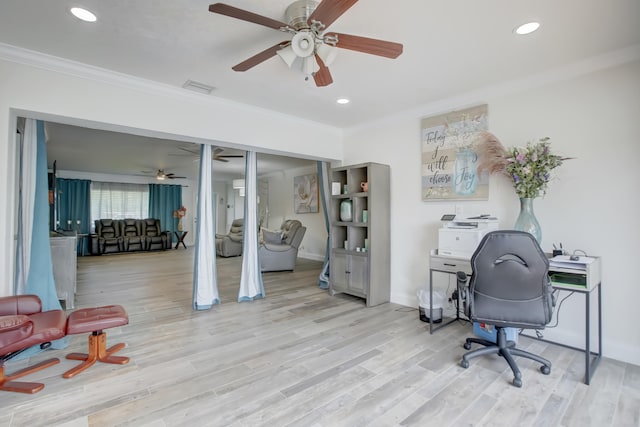 office with ceiling fan, light hardwood / wood-style flooring, and ornamental molding