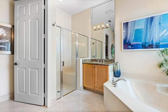 bathroom with vanity, tile patterned floors, and independent shower and bath