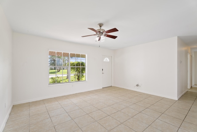 unfurnished room featuring ceiling fan and light tile patterned floors