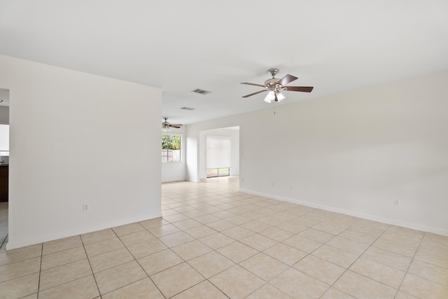 unfurnished room featuring ceiling fan and light tile patterned flooring